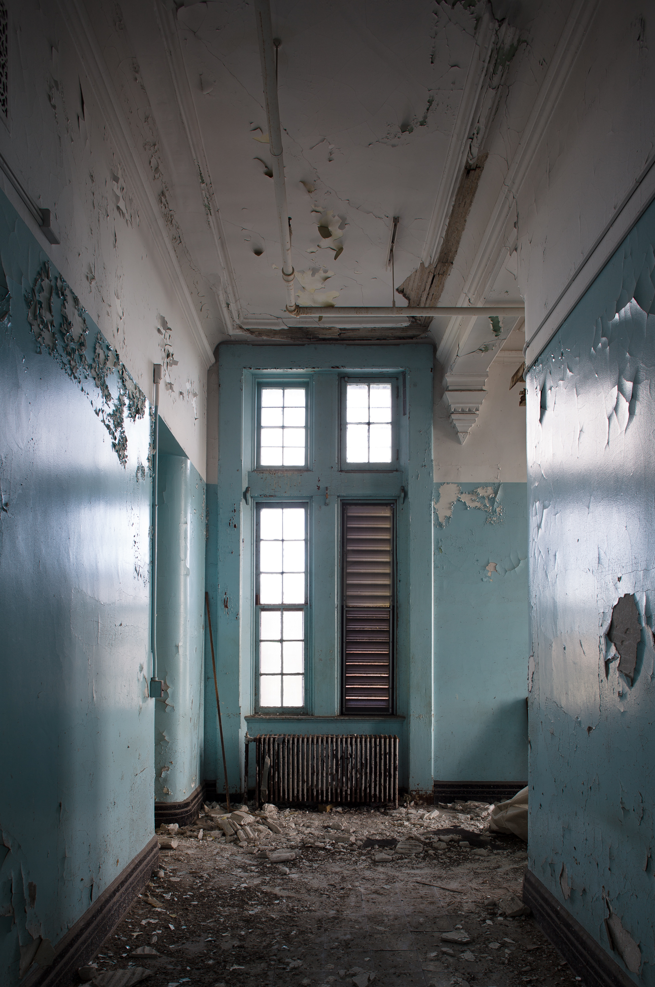 View down a narrow hallway at Buffalo State Hospital
