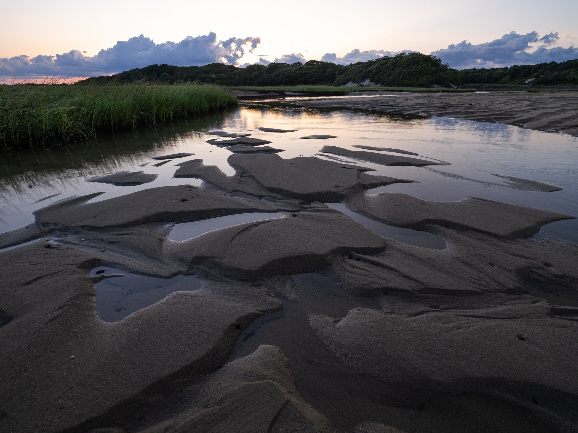 Image of a salt marsh at low tide in Provincetown Massachusetts.