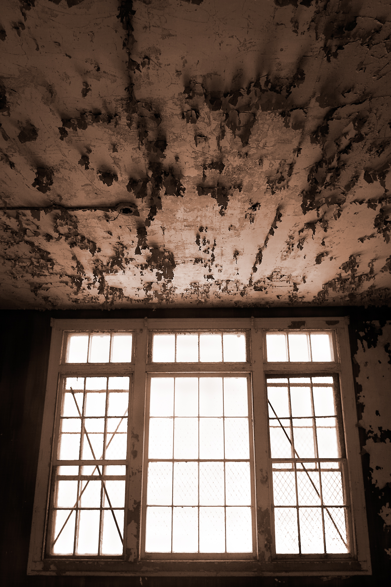 Windows and peeling paint at Northampton State Hospital