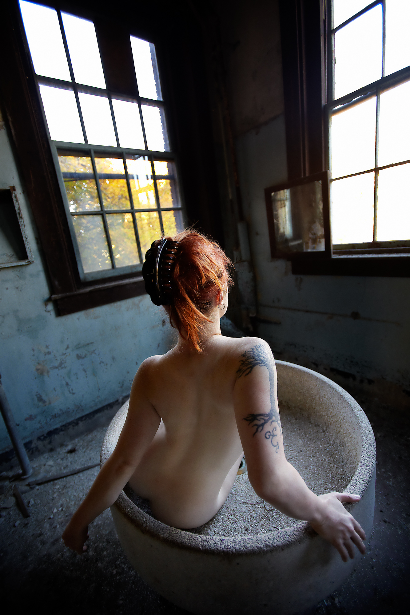 Model X posing in a tub