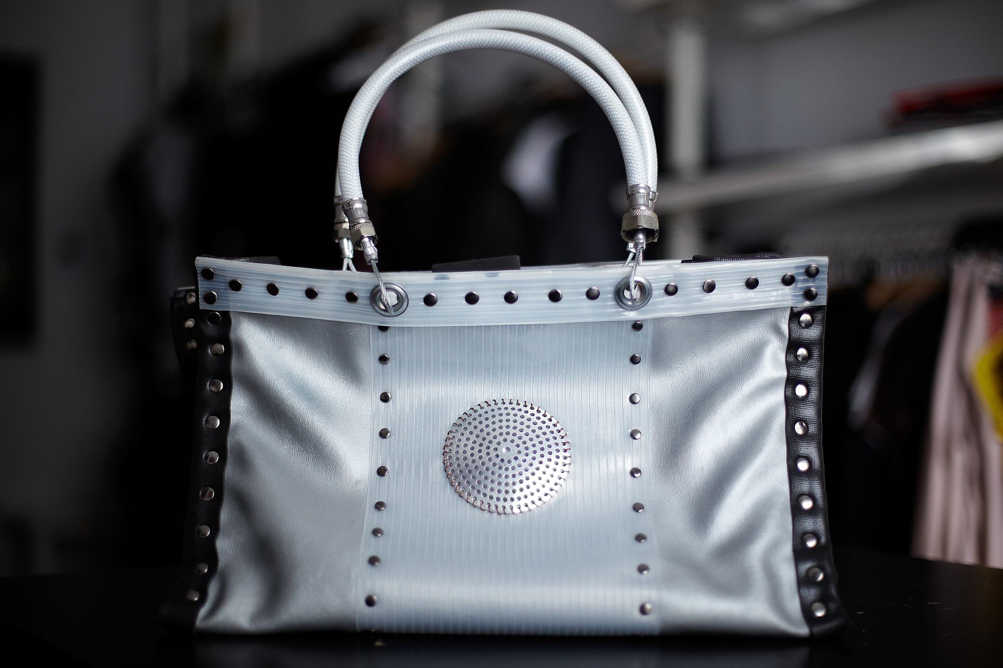 Silver industrial purse on table at DH Studios.
