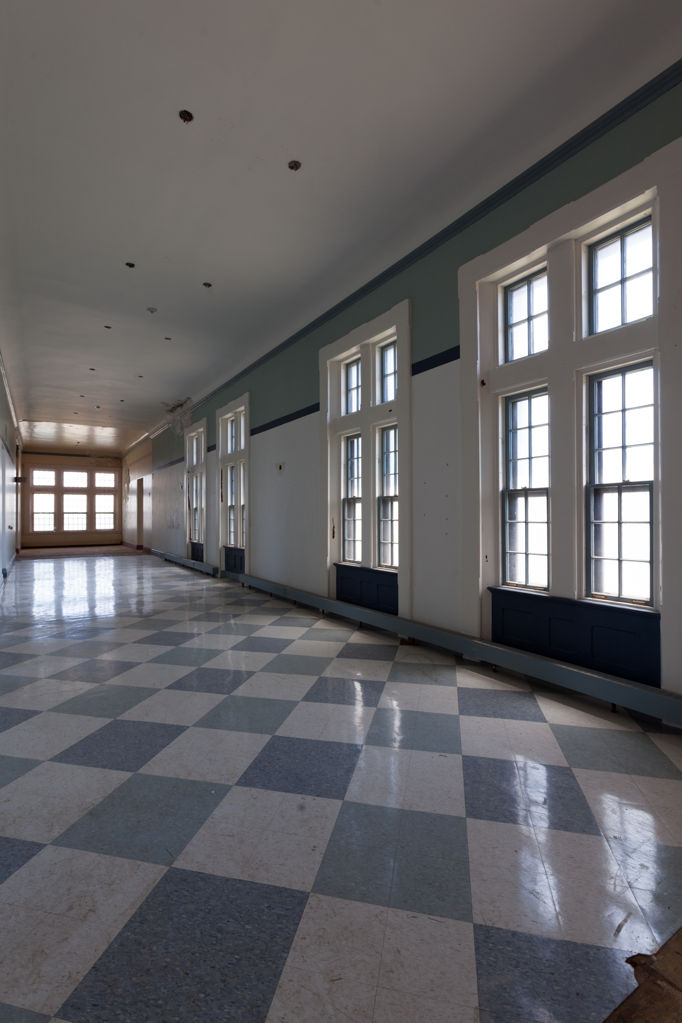 Hallway with checkered floor at Buffalo State Hospital.
