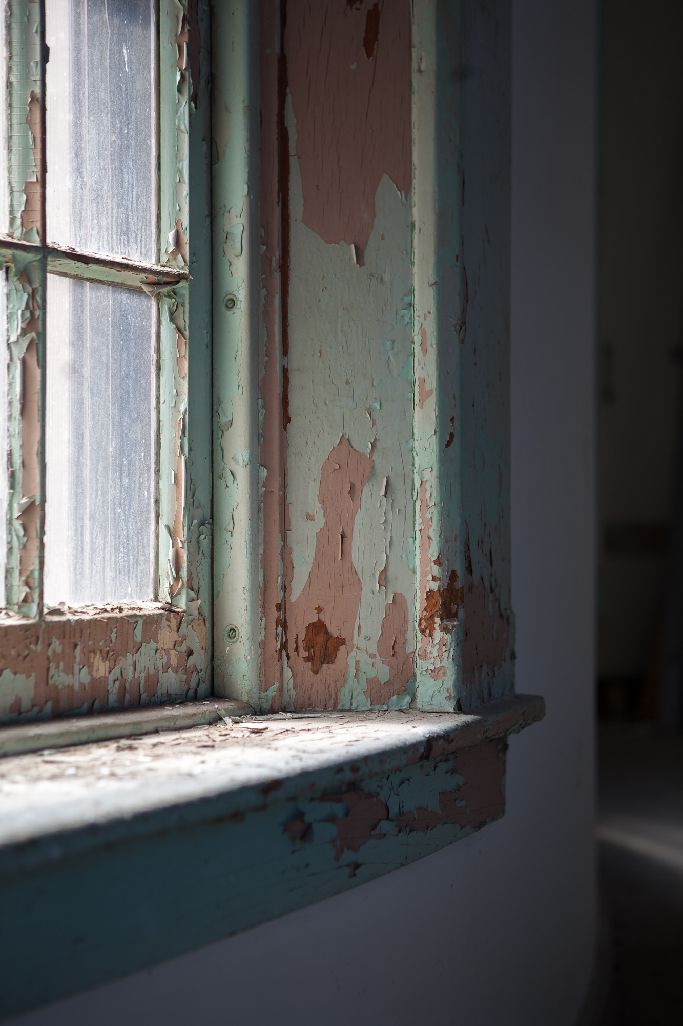 Closeup of a window in a connector between wings at Buffalo State Hospital