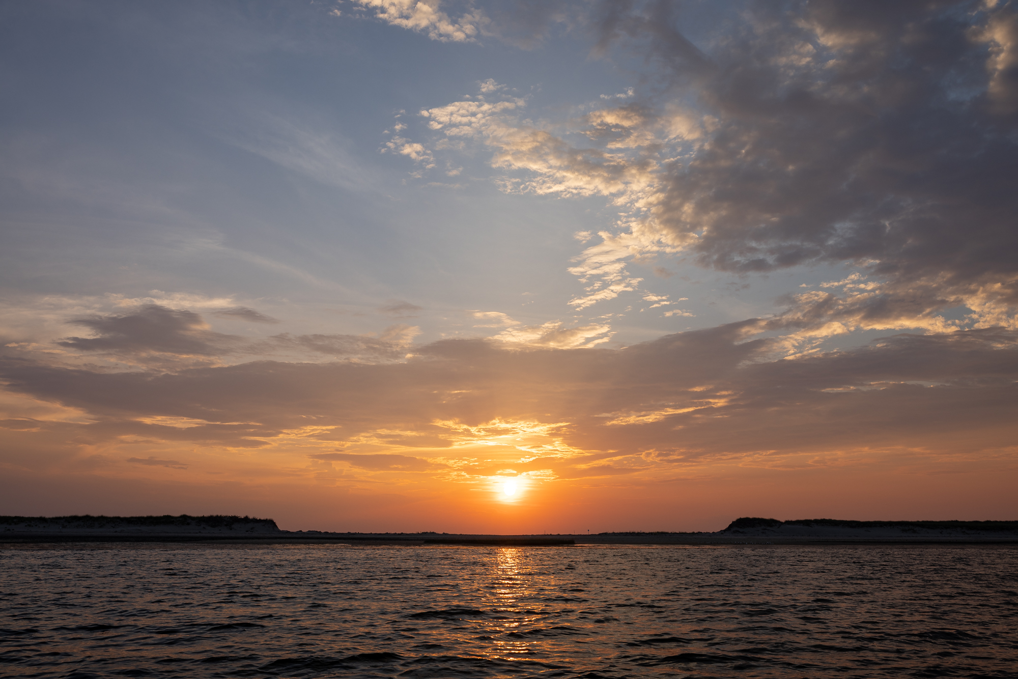 Sunset over Jeremy Point in Welfleet, MA.