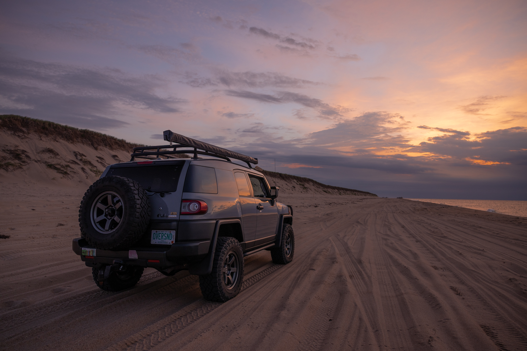 Gray Toyota FJ on Race Point Beach in Provincetown, MA.