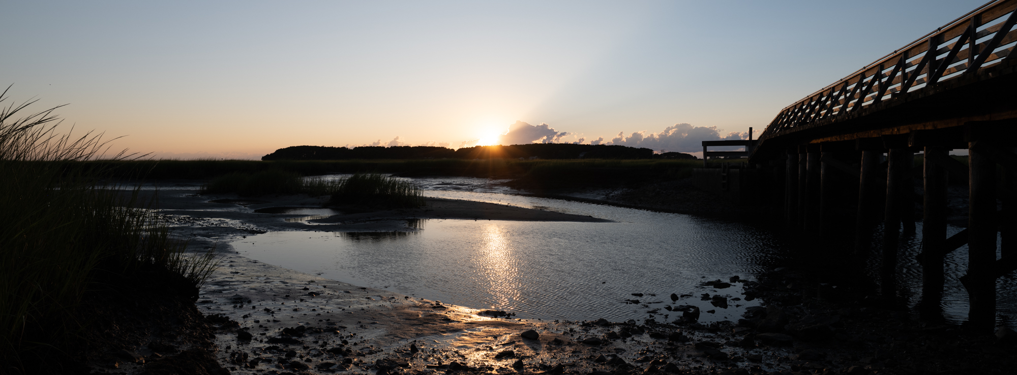 Photograph of the bridge to Lieutennant Island in Welfleet, MA at sunset.