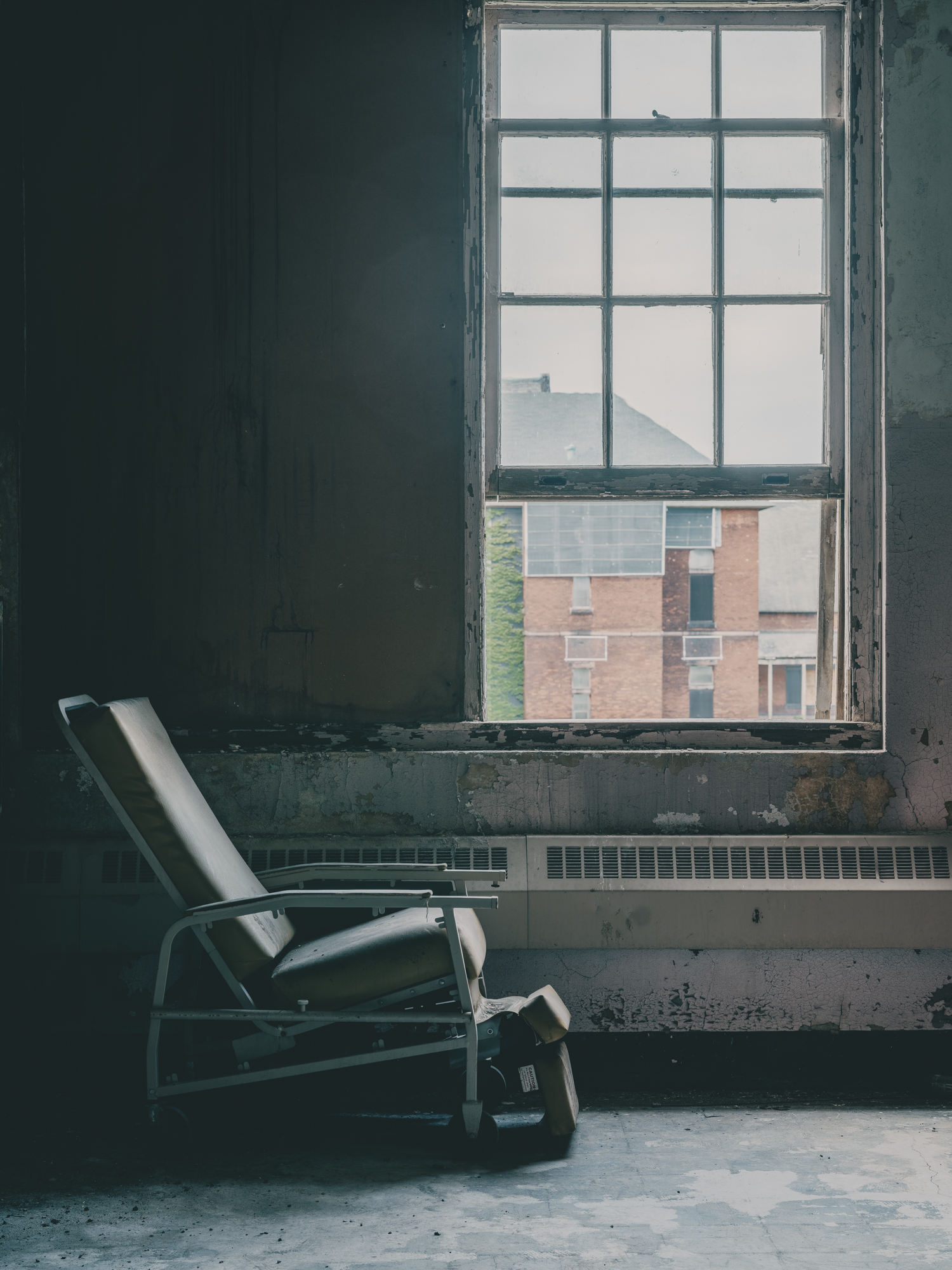 Padded chair by window at Buffalo State Hospital