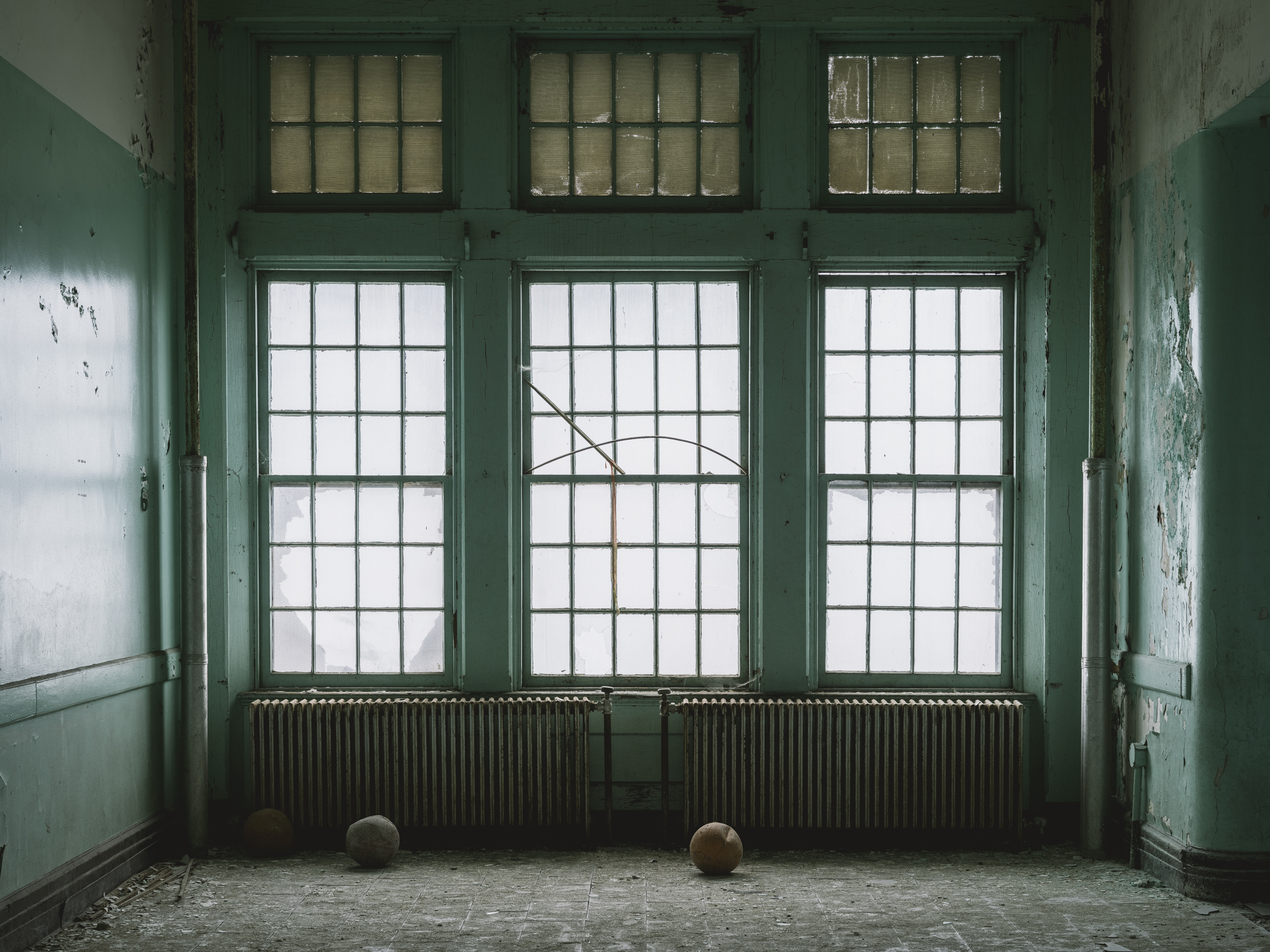 Hospital green hallway and windows at Buffalo State Hospital