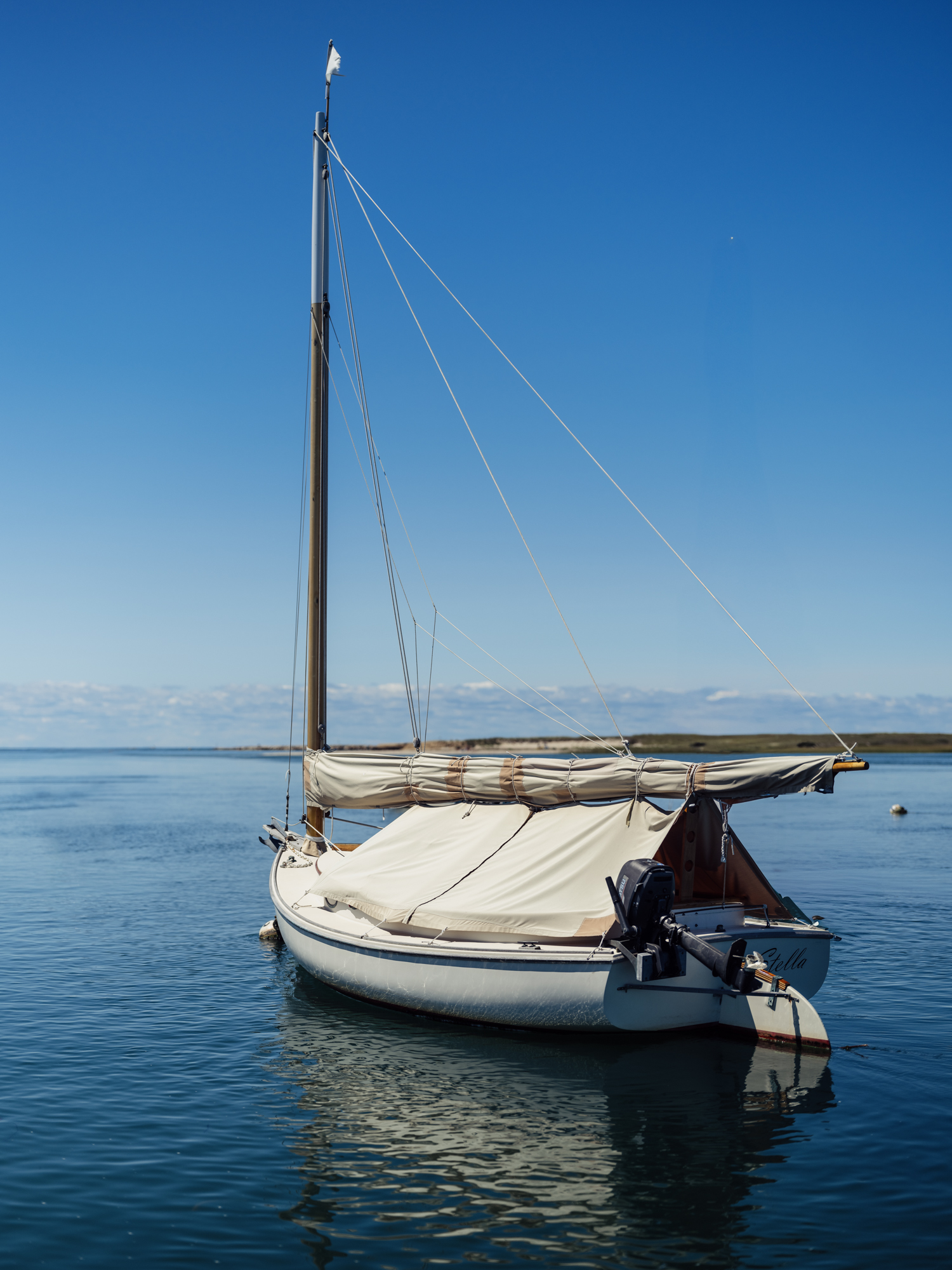 Image of a small sailboat floating in Pamet Harbor in Truro, Massachusetts